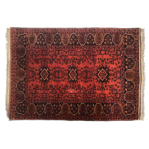 665 - A red ground rug, 103x150cm