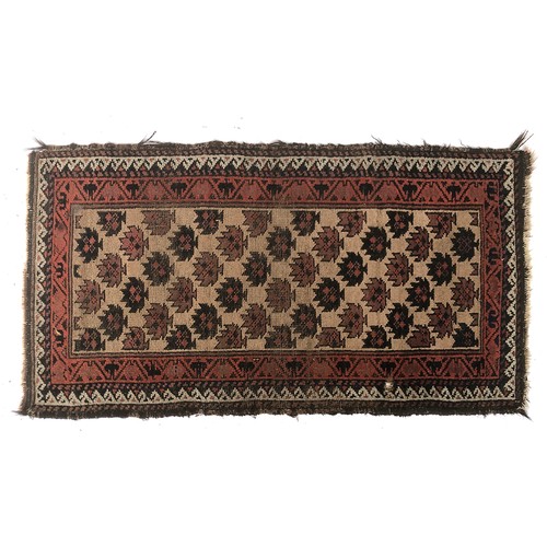 668 - A small Persian rug with dense stylised leaf ground, 61x111cm