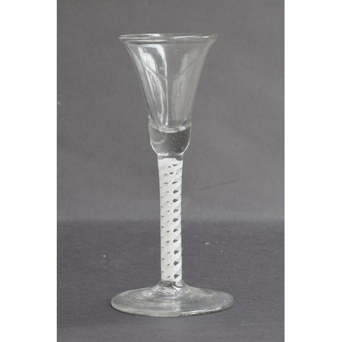 206 - A mid 18th century cordial glass, opaque twist stem on folded foot, 16cm high