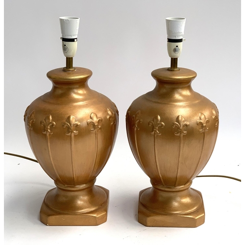 318 - Interior design interest, A pair of Allders gold painted ceramic table lamps, with fleur de lis desi... 