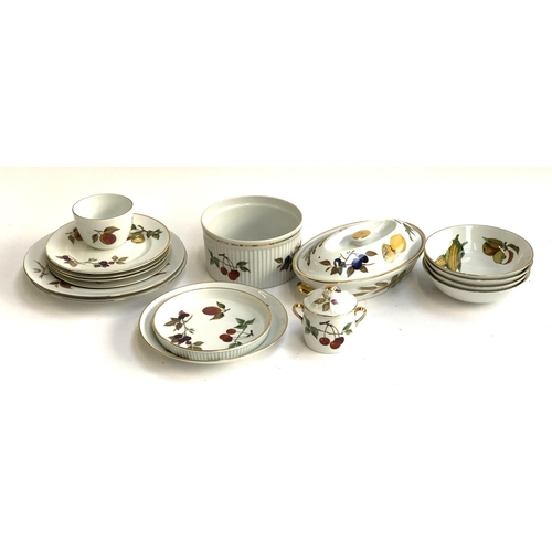 135 - A Royal Worcester 'Evesham' part dinner service to include dinner plates, cake plates, lidded tureen... 