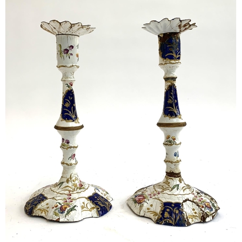 160 - A pair of 18th century South Staffordshire, likely Bilston, enamel candlesticks (af), decorated in b... 