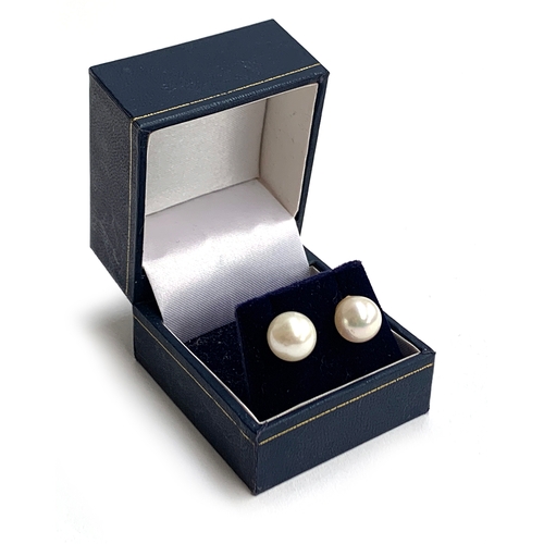 26 - A pair of 9ct gold pearl stud earrings, the pearls approx. 1cmD