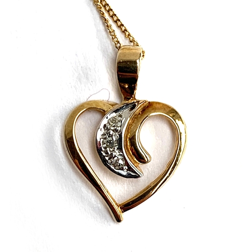 27 - A 9ct gold necklace with a yellow and white gold heart pendant set with three diamonds, the chain 49... 