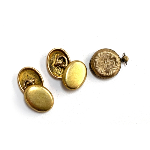 31 - A pair of gold cufflinks, 4.3g; together with a 19th century yellow metal glazed locket (af)