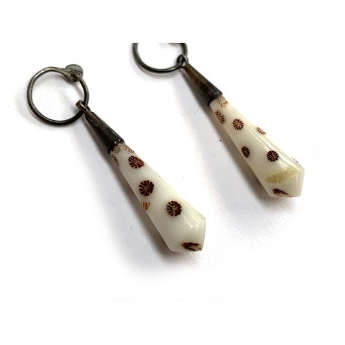 32 - A pair of late 19th/early 20th century polished bush coral drop earrings, with white metal fittings,... 