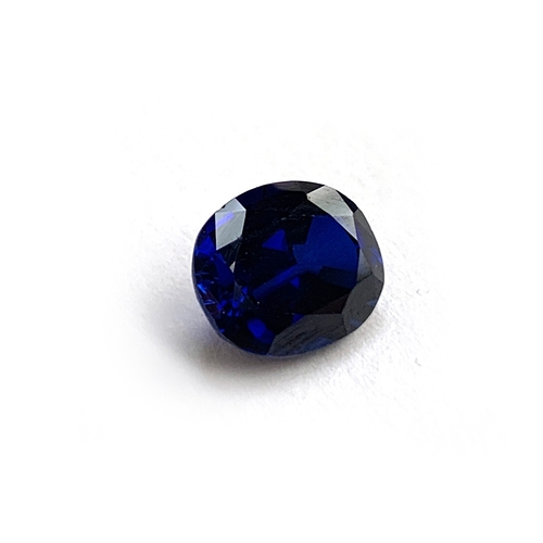 35 - An unmounted inky blue oval cut sapphire, 1x0.8x0.5, 0.75g, approx. 3ct