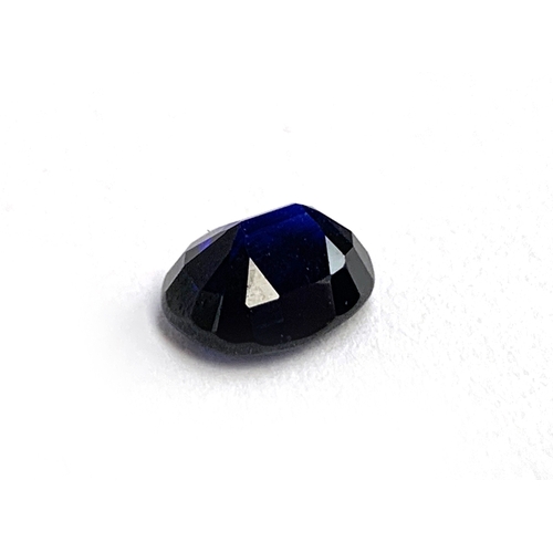 35 - An unmounted inky blue oval cut sapphire, 1x0.8x0.5, 0.75g, approx. 3ct