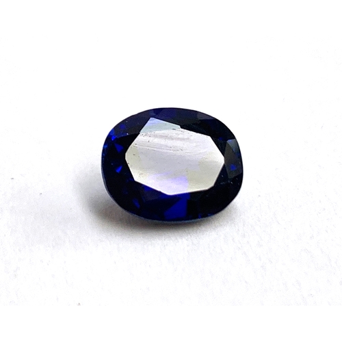 35 - An unmounted inky blue oval cut sapphire, 1x0.8x0.5, 0.75g, approx. 3ct