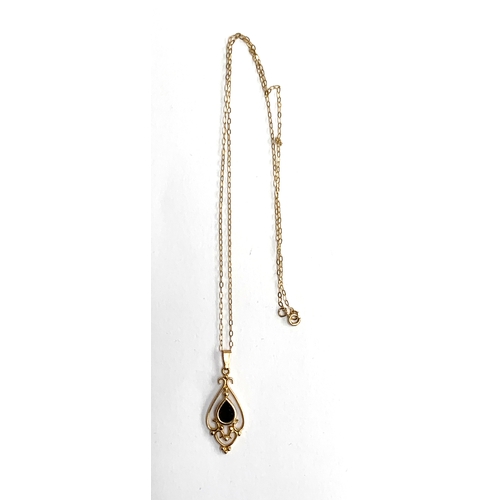 7 - A 9ct gold and garnet pendant on chain, 1.5g