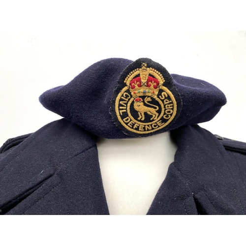 468 - A women's navy double breasted greatcoat for the Civil Defence Corps, size 10, together with a Kango... 