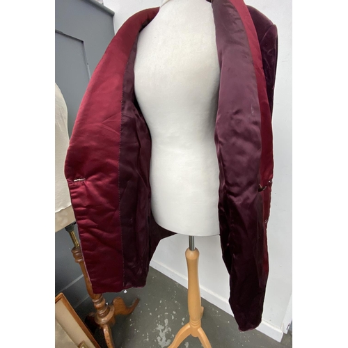 362 - A gent's double breasted smoking jacket with shawl collar and turned cuffs in plum velvet with silk ... 