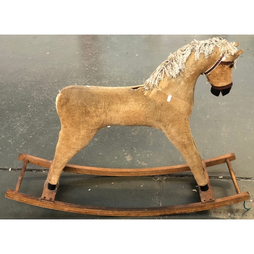 940 - A brown corduroy rocking horse, 105cmL