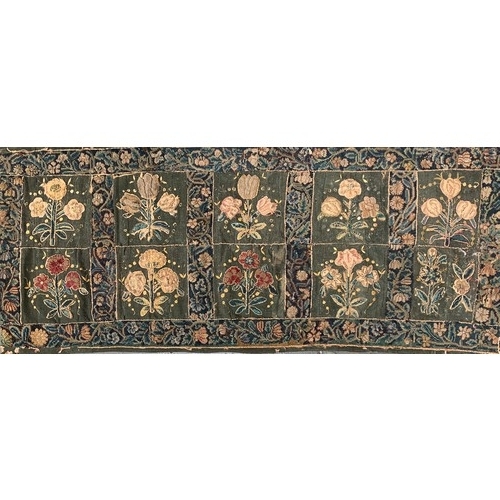 652 - A 17th century needlework tapestry table carpet, ten floral needlework slips depicting tulips, daffo... 