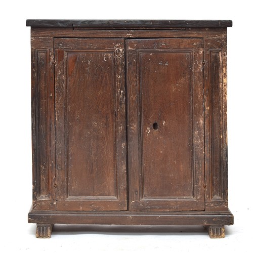 461 - A Tuscan cabinet, 83cm wide, 35cm deep, 88cm high, the doors opening to two internal shelves