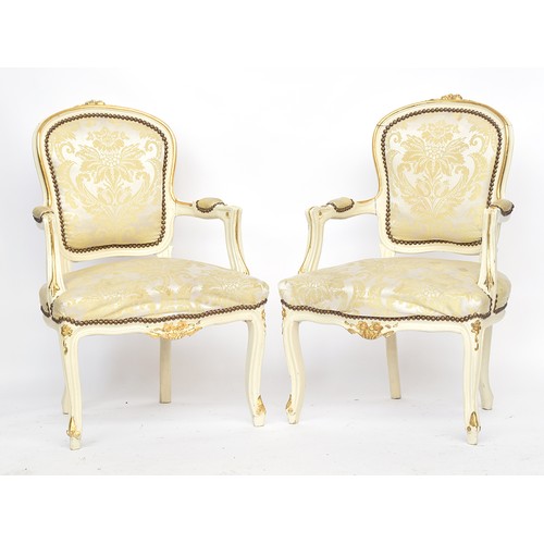 621 - A pair of Louis XV style painted and parcel gilt open armchairs, 20th century, upholstered seat and ... 