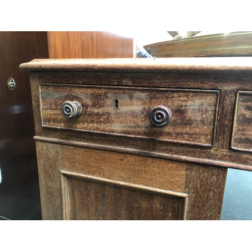 576 - A Victorian mahogany pedestal partner's desk, c.1880, with leather inset top above the three frieze ... 