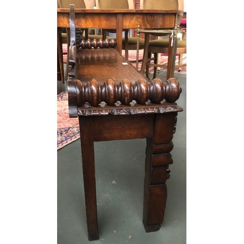 591 - A Victorian oak hall bench, carved in the Jacobethan taste, 128cm wide, 31cm deep, 73cm high