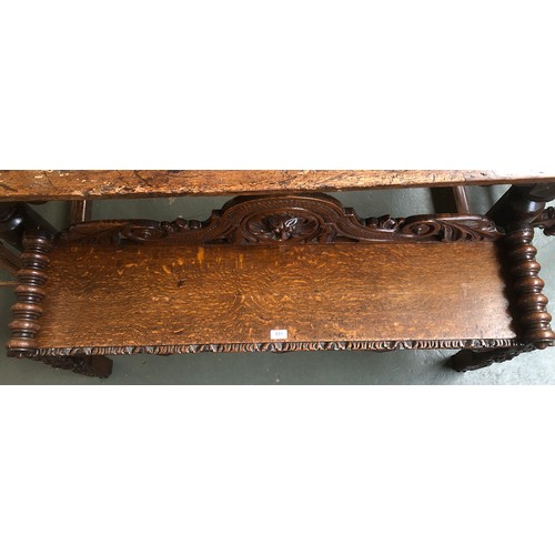 591 - A Victorian oak hall bench, carved in the Jacobethan taste, 128cm wide, 31cm deep, 73cm high