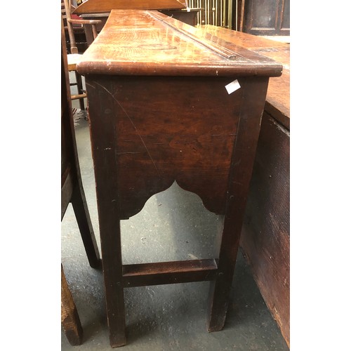 506 - An 18th century oak dresser base, three drawers over a shaped apron, on chamfered square section leg... 