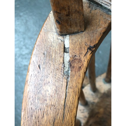 625 - A provincial elm West Country stick back Windsor chair, three part arm bow on bent supports, over a ... 