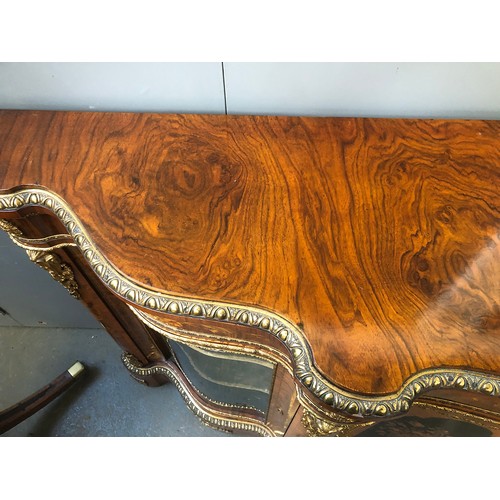 640 - A large Victorian gilt metal mounted walnut, kingwood and marquetry serpentine credenza, the moulded... 