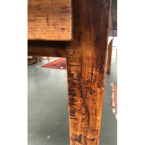 589 - A 19th century French fruitwood kitchen table, five plank top, with single end drawer, on square tap... 