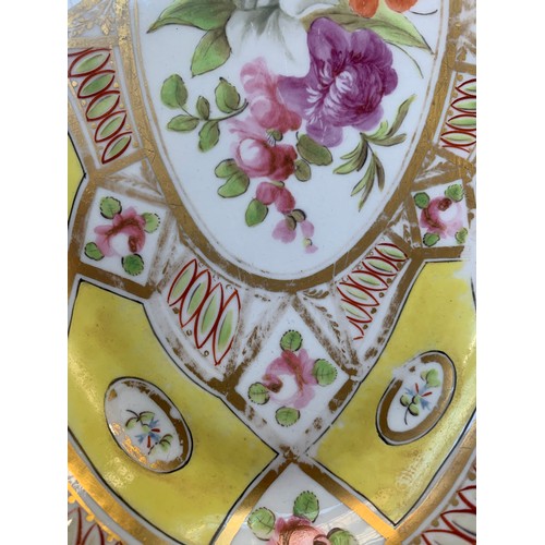 176 - A 19th century part dinner service, hand painted floral design on a yellow ground, heightened in gil... 