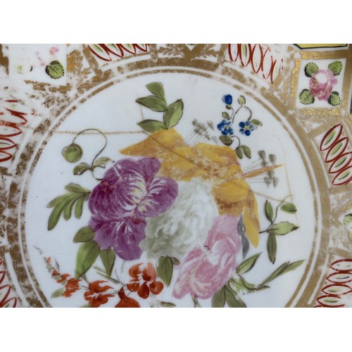 176 - A 19th century part dinner service, hand painted floral design on a yellow ground, heightened in gil... 