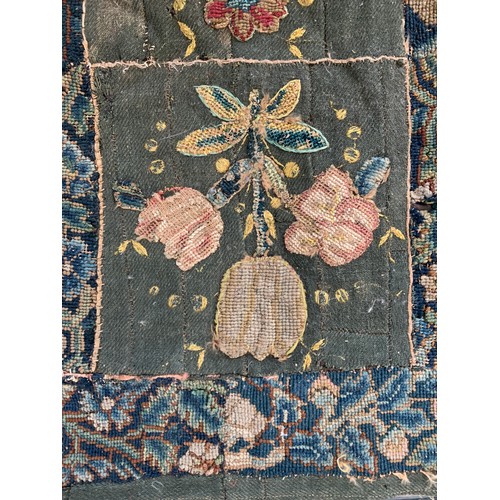 652 - A 17th century needlework tapestry table carpet, ten floral needlework slips depicting tulips, daffo... 