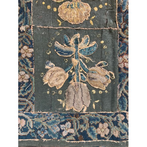 652 - A 17th century needlework tapestry table carpet, ten floral needlework slips depicting tulips, daffo... 