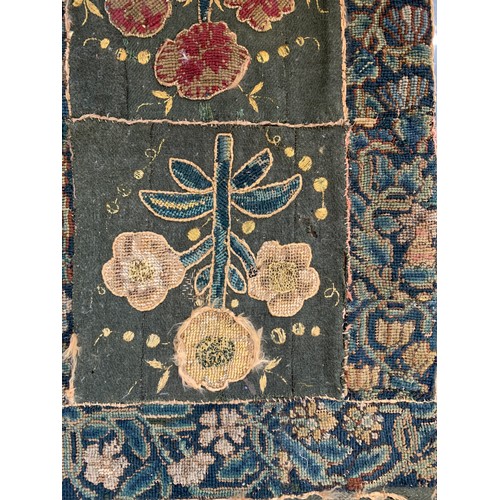 652 - A 17th century needlework tapestry table carpet, ten floral needlework slips depicting tulips, daffo... 