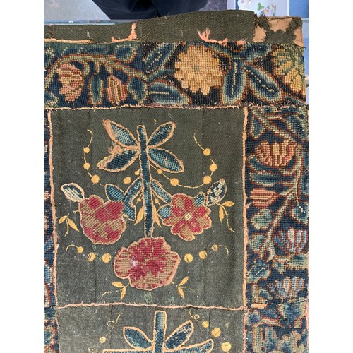 652 - A 17th century needlework tapestry table carpet, ten floral needlework slips depicting tulips, daffo... 