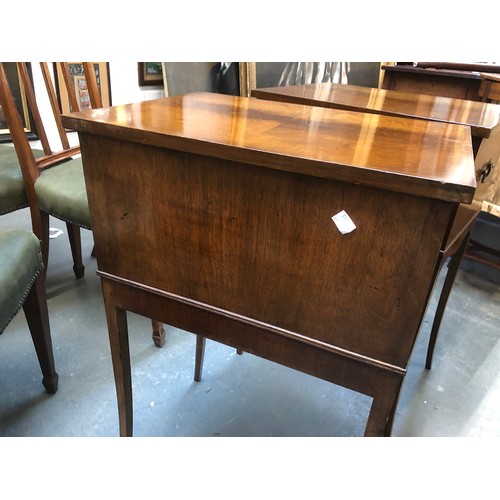 635 - A pair of mahogany cabinets, each with three drawers, with brass carry handles, raised on slender sw... 