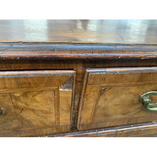 476 - A largely 18th century walnut chest of drawers, the later pine top over three short and three gradua... 