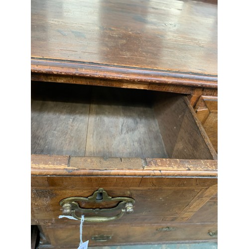 476 - A largely 18th century walnut chest of drawers, the later pine top over three short and three gradua... 