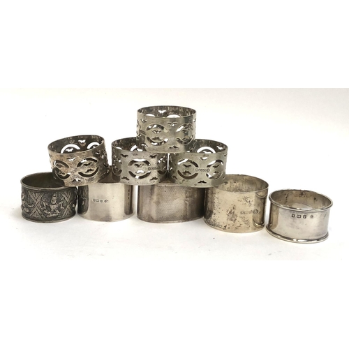 66 - A lot of four napkin rings, a pair by William Hutton & Sons, 3.6ozt; together with a set of four pla... 