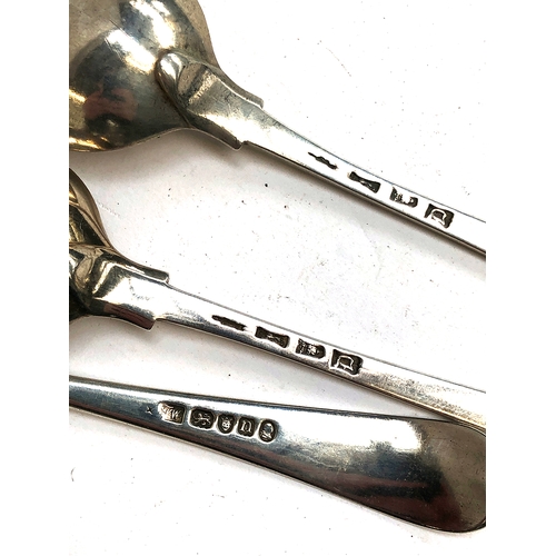 75 - A pair of George II silver table spoons, London 1759; together with a further George III table spoon... 