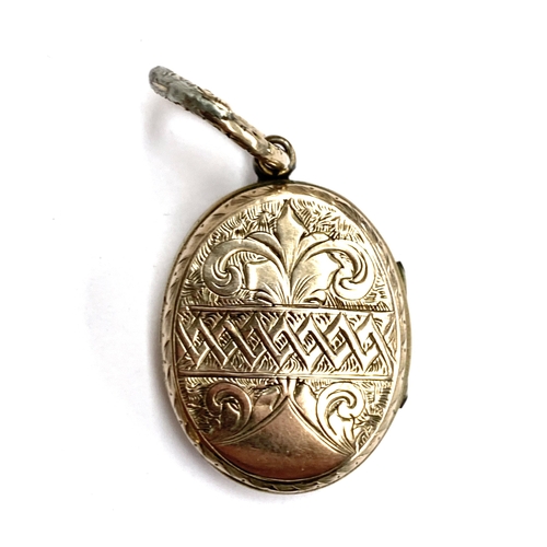 1 - A Victorian gold back and front locket with floral enamel motto decoration, 'Many Happy Returns Of T... 