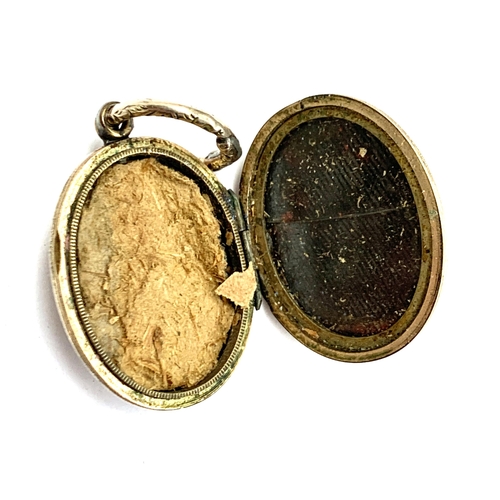 1 - A Victorian gold back and front locket with floral enamel motto decoration, 'Many Happy Returns Of T... 