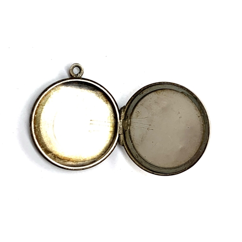 3 - A Victorian silver locket, engraved 'Good Luck' within a horseshoe, 2.2cmD