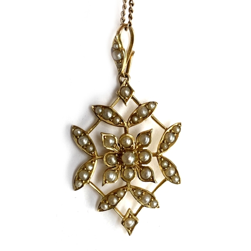 12 - An Edwardian 15ct gold and seed pearl pendant on 9ct gold chain, total weight 7.6g; in a blue velvet... 