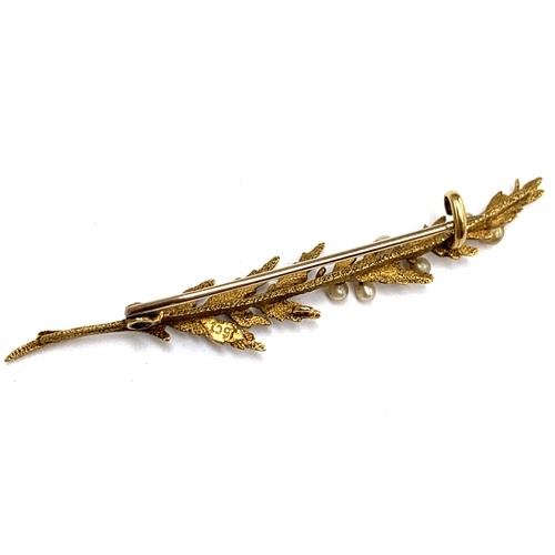 13 - An Edwardian 15ct gold and seed pearl brooch of naturalistic spray form, 5.3cm long, 2.3g, in antiqu... 