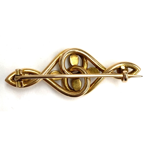 15 - An Art Nouveau 15ct gold and turquoise brooch of swirling form, possibly Murrle Bennett & Co., 4.5cm... 