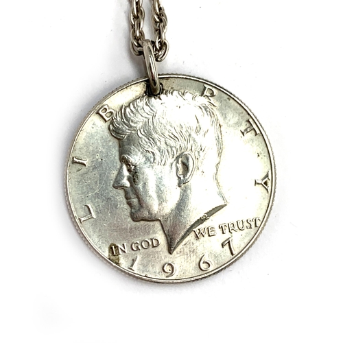 18 - A United States 1967 Half Dollar on a silver chain, 20g; together with six sixpences and a 1948 half... 