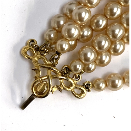 51 - A Butler & Wilson faux pearl six strand necklace, in original box bearing Harrods label, 41cmL