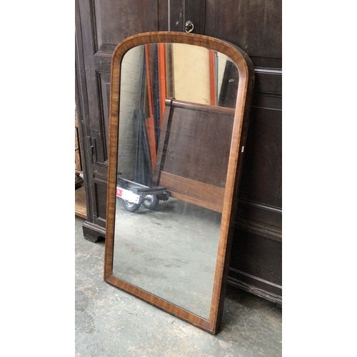 1046 - A 19th century mahogany framed domed mirror (from a cheval), 68x128cm