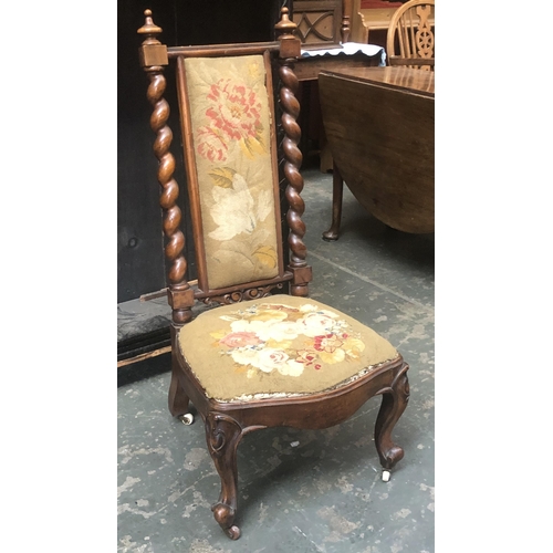 1012 - A 19th century walnut slipper chair, back with central grospoint panel, flanked by barleytwist colum... 