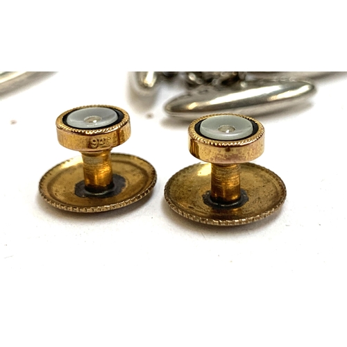 58 - A quantity of cufflinks and studs to include a pair of mother of pearl and black enamel studs hallma... 