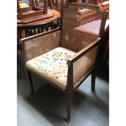 1034 - A caned bergere chair